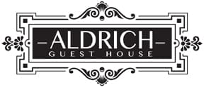 Logo for Aldrich Guest House featuring elegant typography and decorative elements.